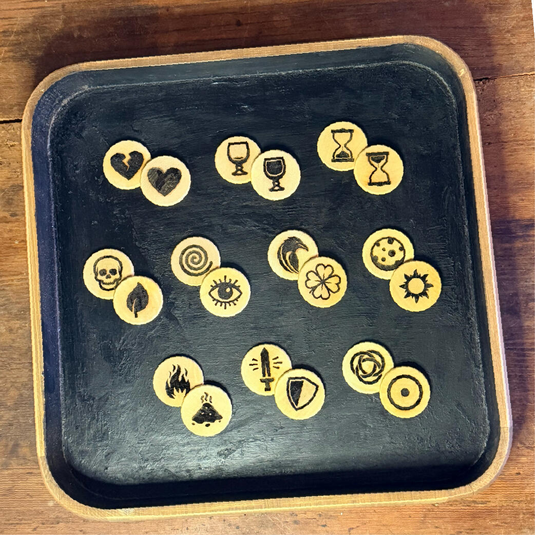 The ten coins Ten two-faced wooden casting coins for divination, both sides shown, The Lot oracle by WMFrewolfe